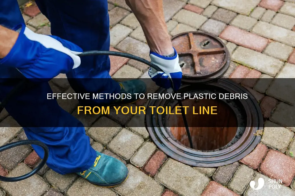 how to clear plastic debris from toilt line