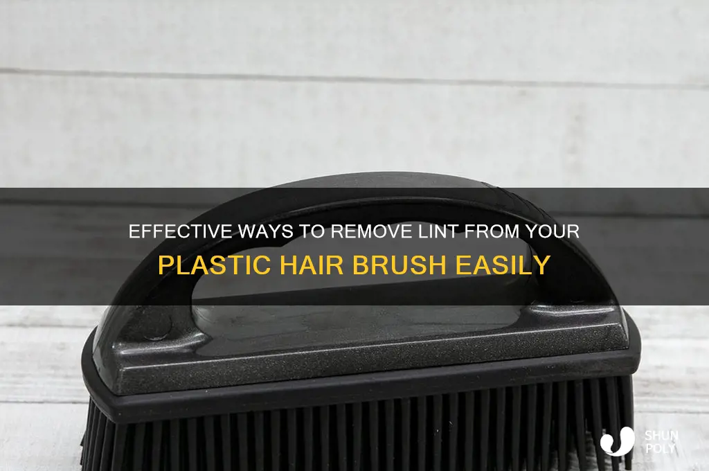 how to get lint out of all plastic hair brush