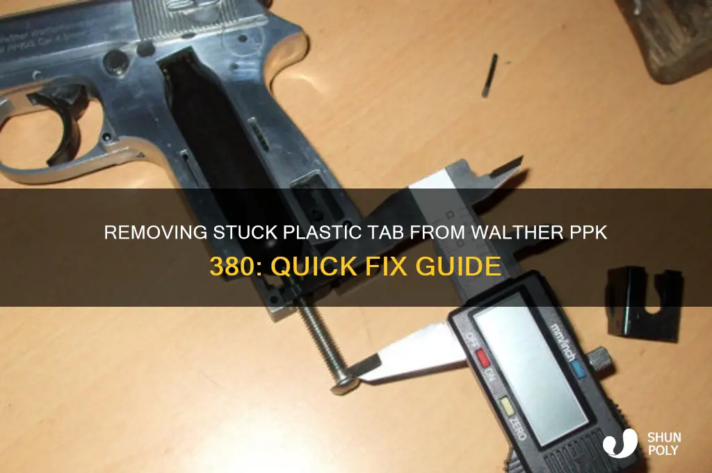 how to get plastic tab out of walther ppk 380