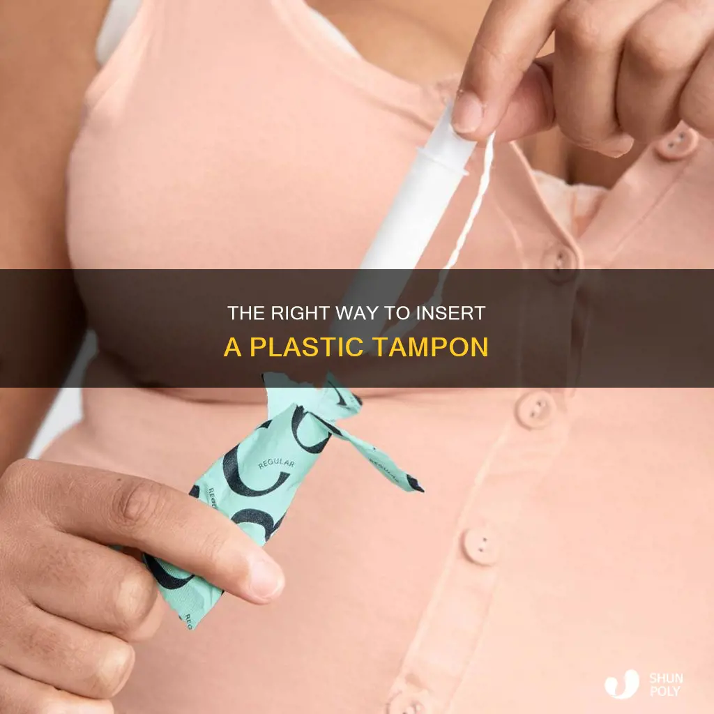 how to insert a plastic tampon