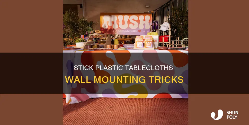 how to stick plastic tablecloths on wall