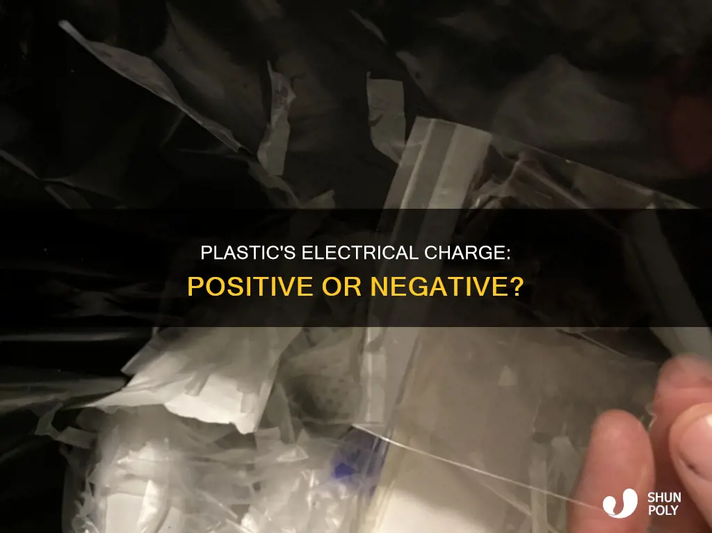 is plastic positively or negatively charged