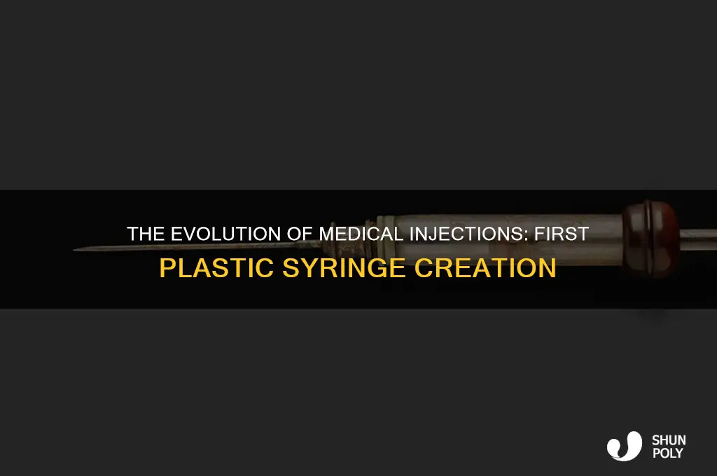 when was the first plastic syringe made